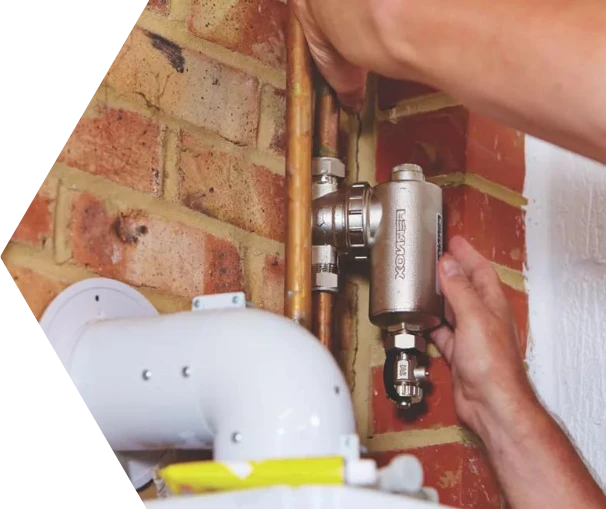 Plumber installing outside tap