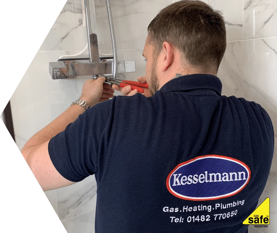 Plumber installing outside tap