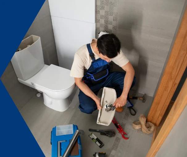 Plumber installing outside tap