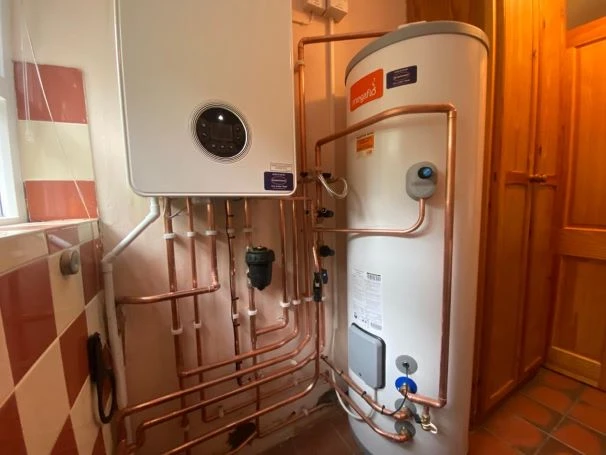 Plumber installing outside tap